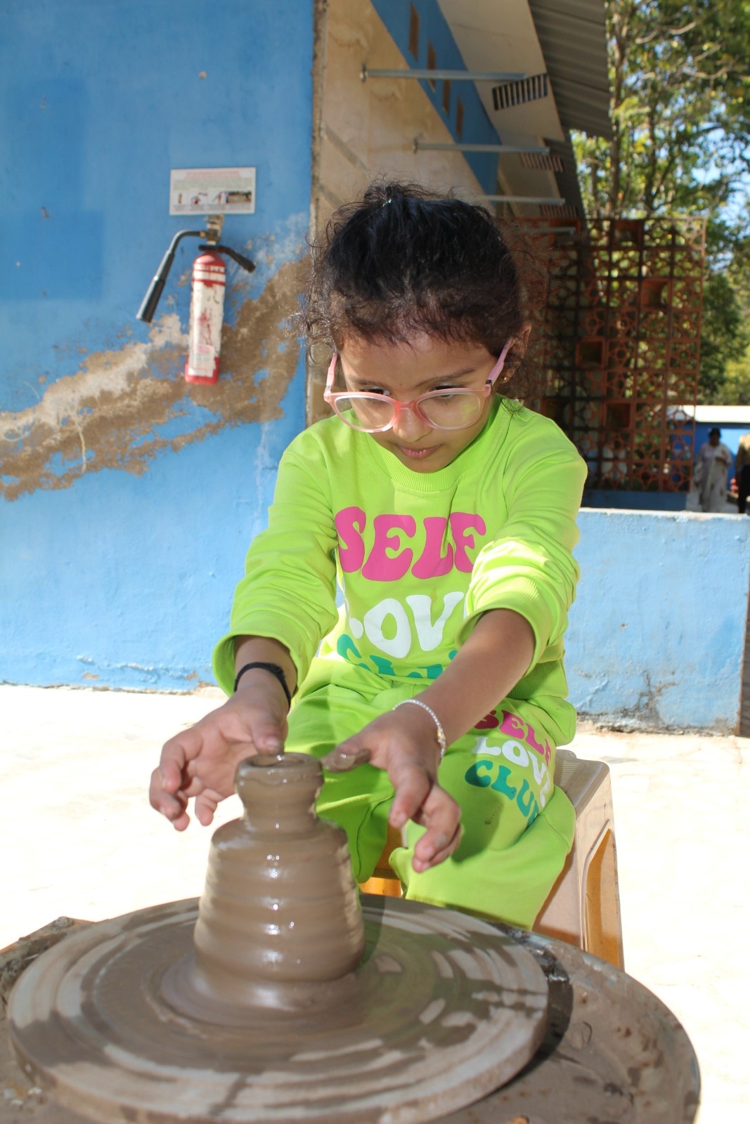 Kid doing Pottery