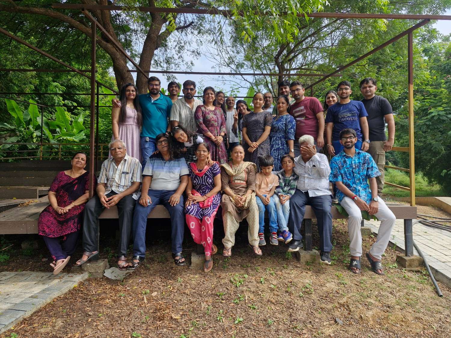 Family relaxing under a shaded structure