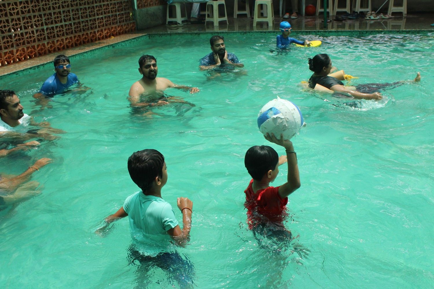Families playing in the swimming pool