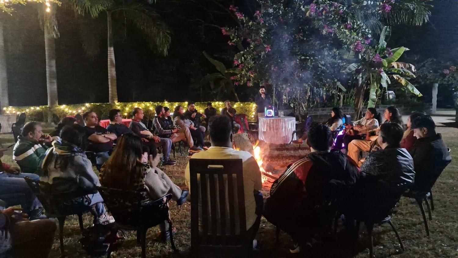 Group discussion at campfire