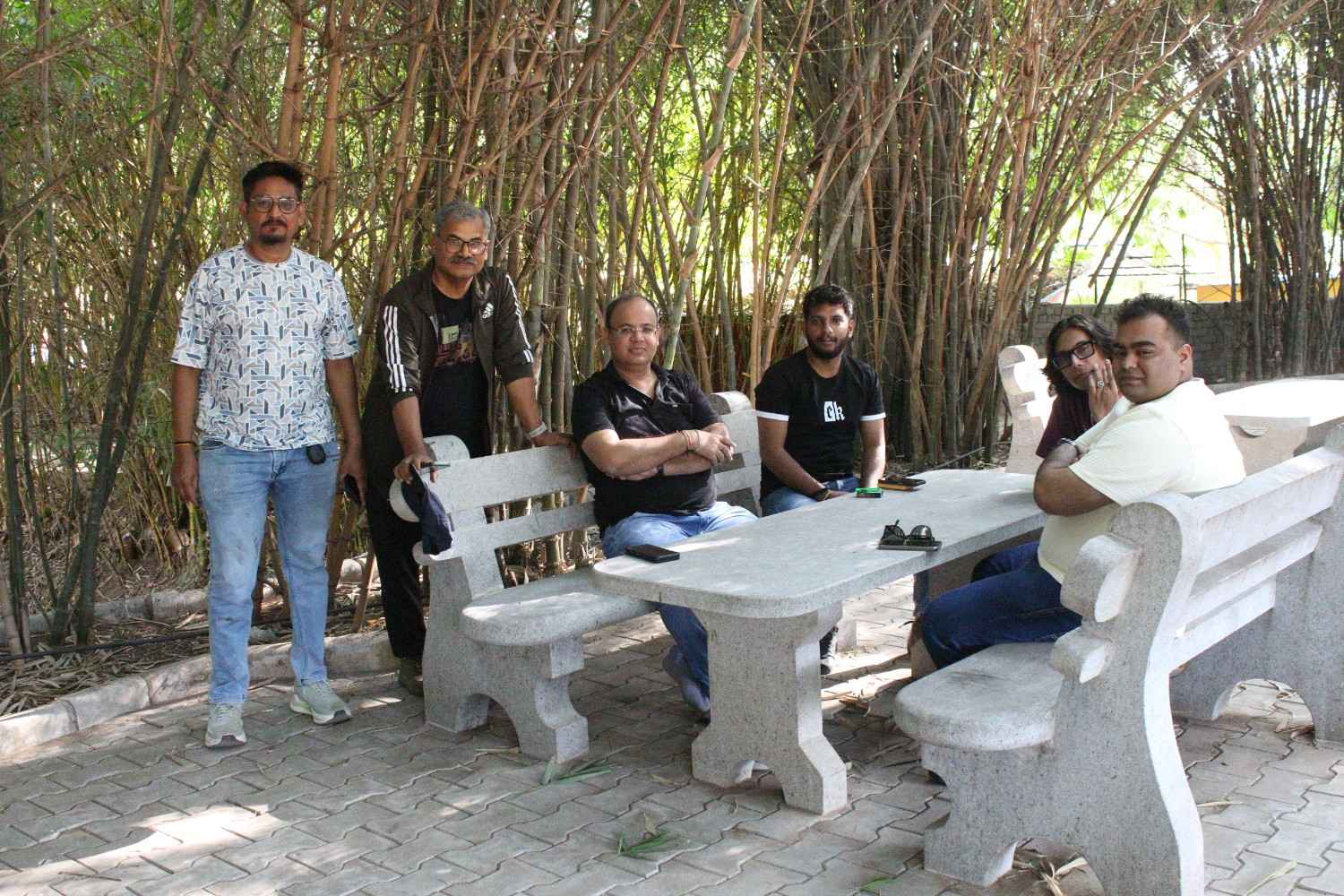 Colleagues chatting on outdoor bench