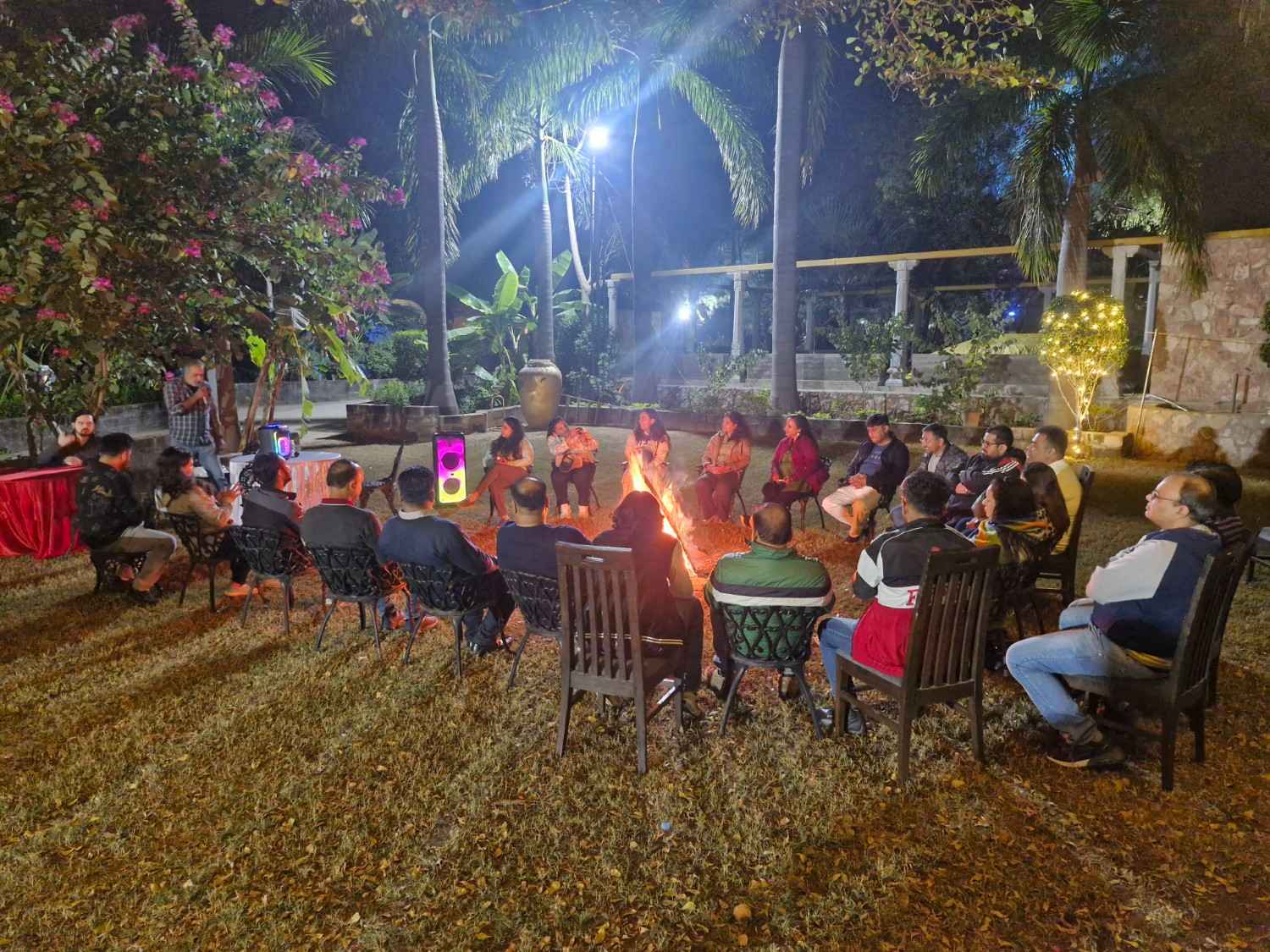 Team gathering around bonfire