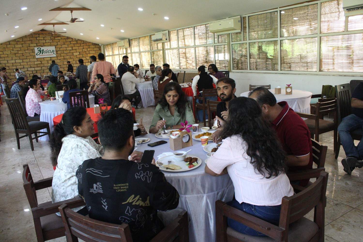 Team enjoying lunch at round tables