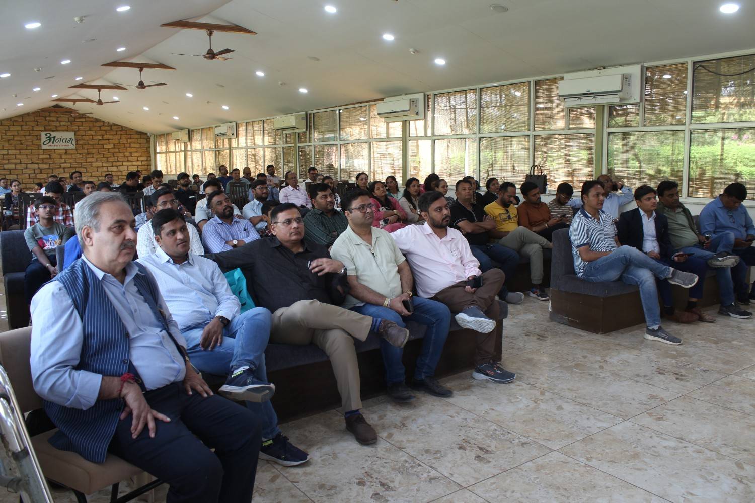 Corporate team listening to speaker